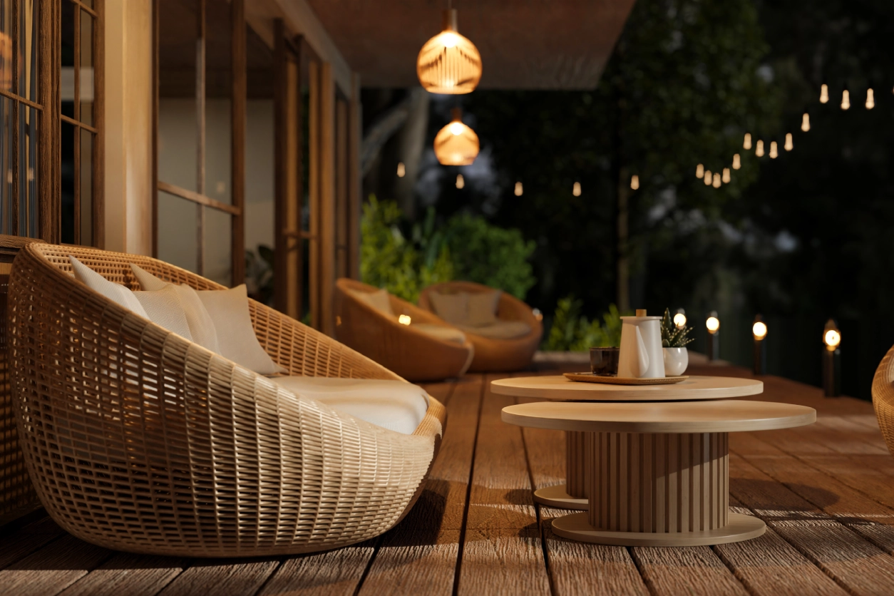 Relaxing patio with wicker furniture at night.